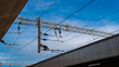 © Wutthikrai - Overhead electric live wire for the train system in the UK against the blue sky.