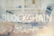 © peshkova - Blockchain theme hud with man working on computer on background. Concept of crypto chain. Double exposure.