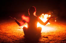 Woman Meditating With A Fire