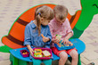 © lithiumphoto - Girl and boy preschool students eating their lunches from lunch boxes