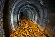 Dark Dirty Abandoned Uranium Mine With Rusty Remnants Of Railway