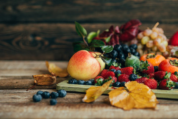 Wall Mural - Fresh and colorful fruits in a wooden tray. Healthy fruits.