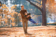 © Mediteraneo - Happy father and little son playing and having fun outdoors over autumn park background