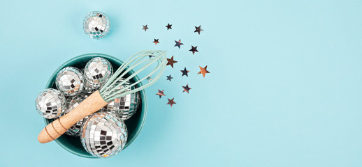 Wall Mural - Flat lay with disco balls in the bowl with whisk. Party, fun, celebration planning