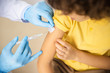 Child given shot by practitioner stock photo