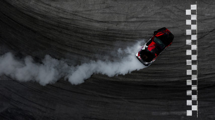 Wall Mural - Aerial top view car drifting on asphalt race track with start and finish line and lots of smoke from burning tires, Auto or automobile background concept.