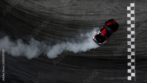 Fotomural Aerial top view car drifting on asphalt race track with start and finish line and lots of smoke from burning tires, Auto or automobile background concept