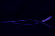 purple fork reflects on dark background abstract background with lines