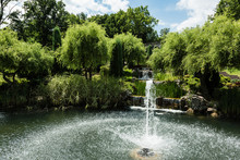 Water Splash Near Fountain In Pond In Green Park