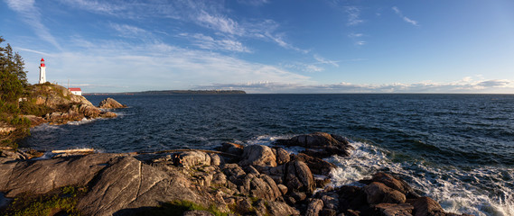 Wall Mural - Beautiful Panoramic view of a rocky ocean coast during a vibrant sunny sunset. Taken in Lighthouse Park, Horseshoe Bay, West Vancouver, British Columbia, Canada.