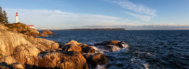 Wall Mural - Beautiful Panoramic view of a rocky ocean coast during a vibrant sunny sunset. Taken in Lighthouse Park, Horseshoe Bay, West Vancouver, British Columbia, Canada.
