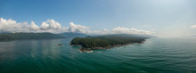 Beautiful Aerial Panoramic Landscape View Of The Rocky Pacific Ocean Coast In The Southern Vancouver Island During A Sunny Summer Day. Taken Between Victorial And Port Renfrew, BC, Canada.