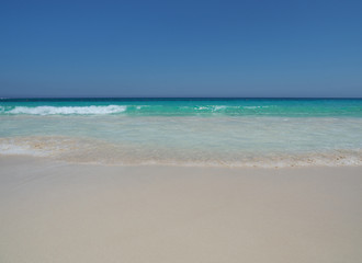 Marsa Matruh, Egypt. The sandy beach and the amazing sea with tropical blue, turquoise and green colors. Relaxing context. Fabulous holidays. Mediterranean Sea. North Africa. Clean and pristine sea