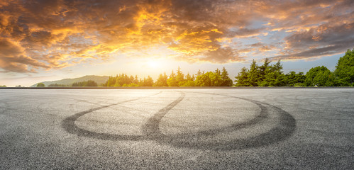 wide race track and green woods nature landscape at sunset