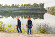 © satura_ - Children, childhood, people concept - Kids boys playing on a beach near river