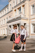 © Andrii - Back to school. Schoolgirls have fun