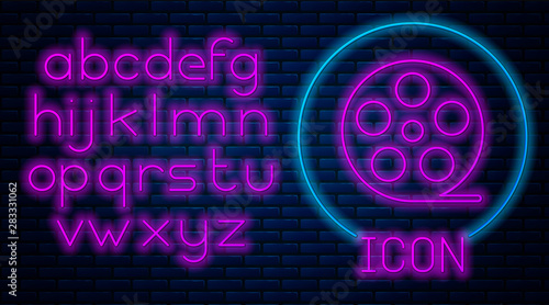 Glowing neon Film reel icon isolated on brick wall background Fototapete