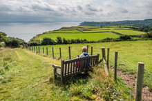Walking On The Cleveland Way Between Robin Hoods Bay And Cloughton In North Yorkshire