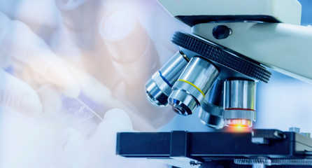 Wall Mural - close-up shot of microscope equipment with metal lens at microbiologal laboratory