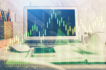 Double exposure of graph and financial info and work space with computer background. Concept of international online trading.