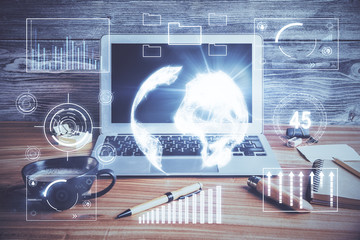 Multi exposure of graph and financial info and work space with computer background. Concept of international online trading.