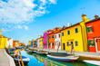 Colorful houses on the canal in Burano island, Venice, Italy. Famous travel destination