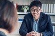 © weedezign - businessman interview with interviewer candidate see qualification  data that apply for job at meeting room in modern office