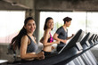 © Blanscape - Asian friends run on machine at gym
