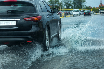 odessa, ukraine - august 9, 2019: driving car on flooded road during flood caused by torrential rain