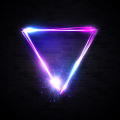 Wall Mural - neon abstract triangle with star explosion, particles on black brick wall background. glowing frame.