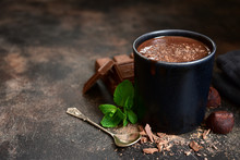 Homemade Hot Chocolate With Mint In A Black Mug.