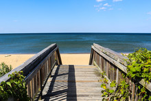 Walkway Leading To Ocean View Beach In Norfolk, Virginia With The Chesapeake Bay In The Background.