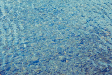 Shining blue wavy water surface ripple background