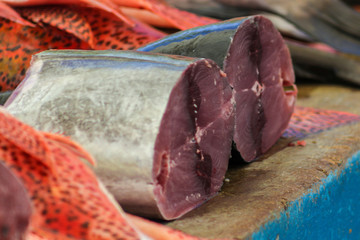 Detail of two pieces of tuna displayed in a market stall