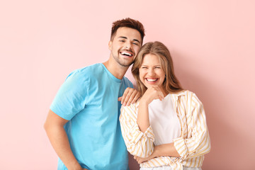 Canvas Print - Portrait of happy couple on color background