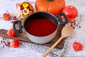 Sticker - Creamy red sauce in big pot.