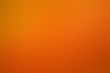 Abstract background of caramel and chocolate texture. Orange and brown gradient