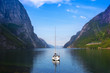 Sailing boat in waters of Lysefjord, Norway