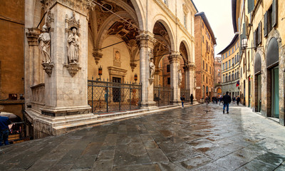 Wall Mural - Old medieval streets of Siena, Tuscany, Italy. Siena architecture and landmark. Picturesque streets of Siena, Italy.Travel destination of Italy and Siena. 