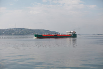 Barge pushed by tug boat on the river