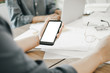 © I Believe I Can Fly - Mockup image of engineers using smartphone to drawing design building Project in office, mockup concept