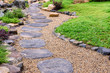 © nuwatphoto - Stone stepping pathway in a Japanese style garden