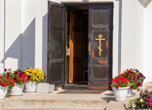 Entrance Door To The Temple With A Cross
