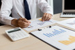 © Puwasit Inyavileart - The professional investor, businessman Executives are working and analyzing project statistics result in report investment and planning strategic marketing, financial and accounting concept