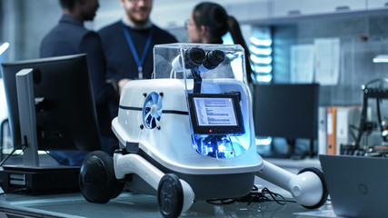 Wall Mural - shot of a working robot prototype in a modern laboratory/ research center creating robotics. multiet