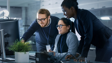 Wall Mural - diverse team of research engineers working in a high tech laboratory on a high profile start-up. tea