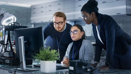Wall Mural - diverse team of research engineers working in a high tech laboratory on a high profile start-up. tea