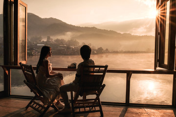 Asian couple drinking Tea Sunrise at Lee wine Rak Thai, Chinese settlement, Mae Hong Son, Thailand