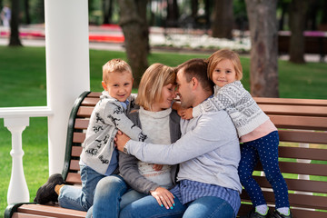 Happy family having fun together in the park outdoor