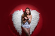 © Volodymyr - Angel woman with wings isolated. Romantic young beauty as an angel. Angel with gift. Angel girl. Happy Valentines Day.